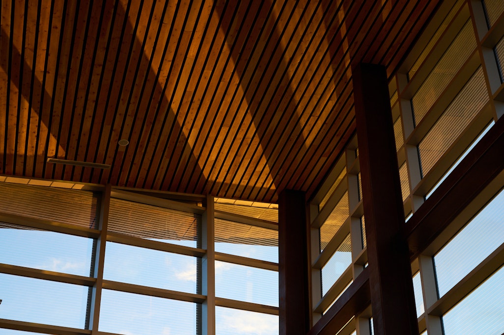 detail of the window and roof from the inside of the summit house, with sunrise and shadows through the window