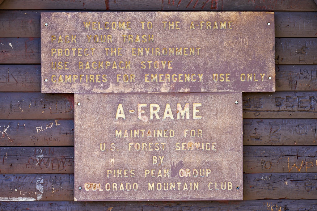 sign on the A-Frame MAINTAINED FOR US FOREST SERVICE BY PIKES PEAK GROUP COLORADO MOUNTAIN CLUB