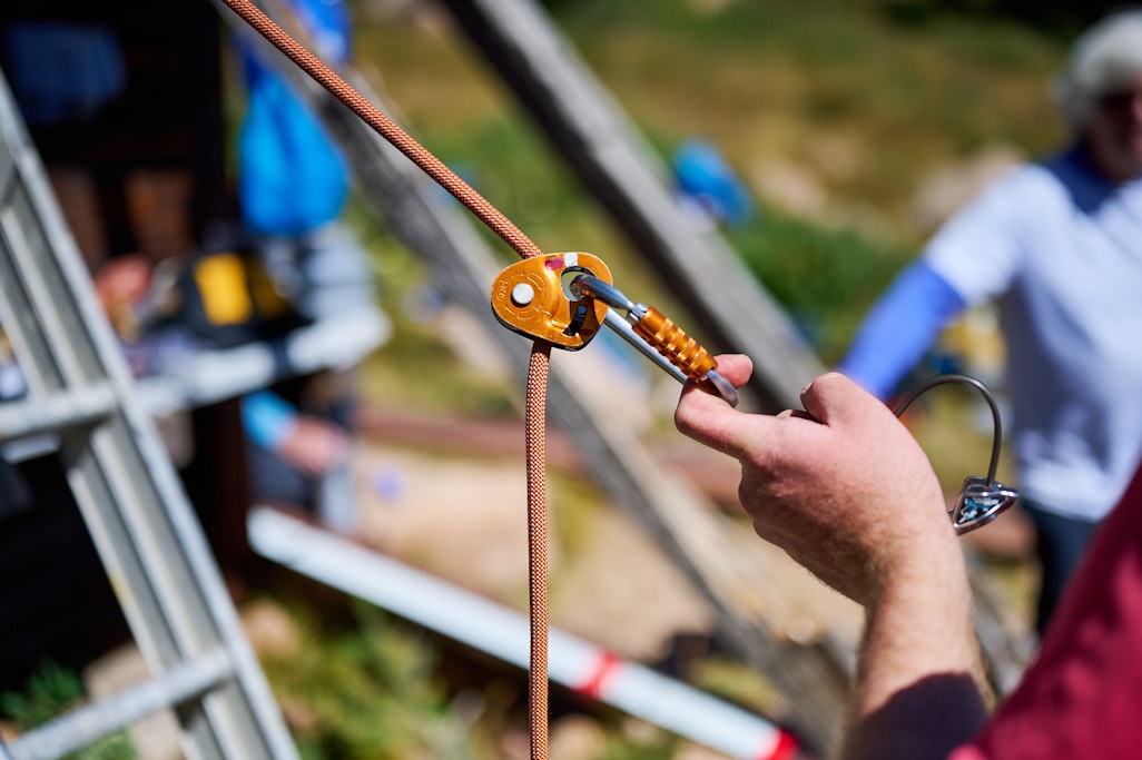 detail of testing a carabiner attached to a climbing rope
