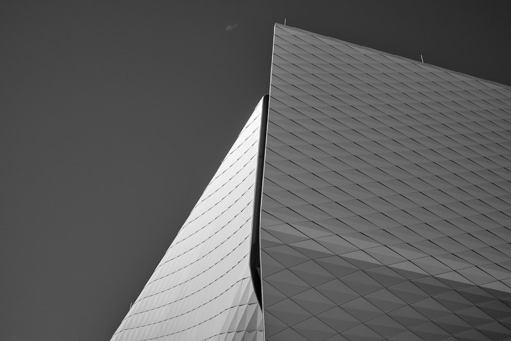 an abstract shot of the Olympic Museum, completely made up of angular metal shingles