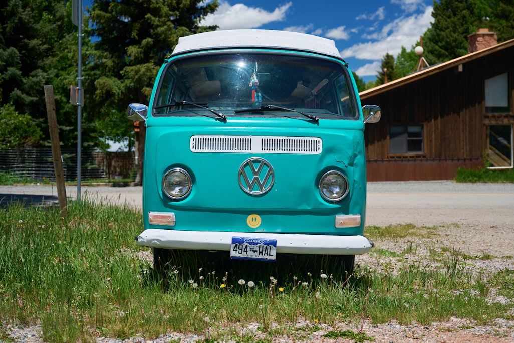 front view of a green Volkswagen Bus, parked in Lake City, Colorado