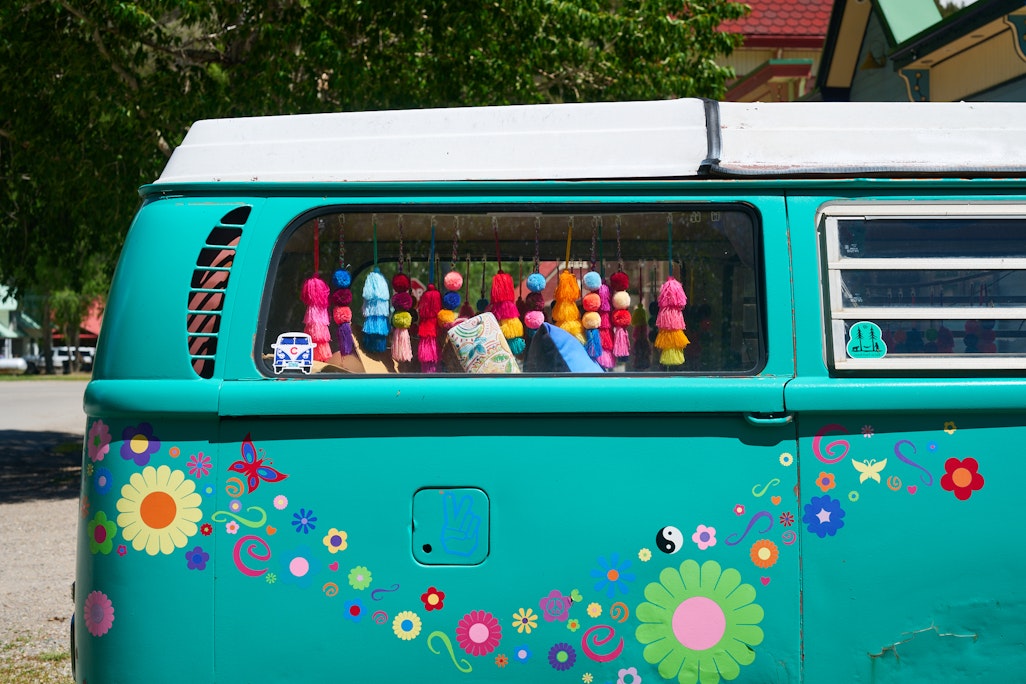 side detail of a green Volkswagen Bus, colorful interior and hand-painted exterior, parked in Lake City, Colorado