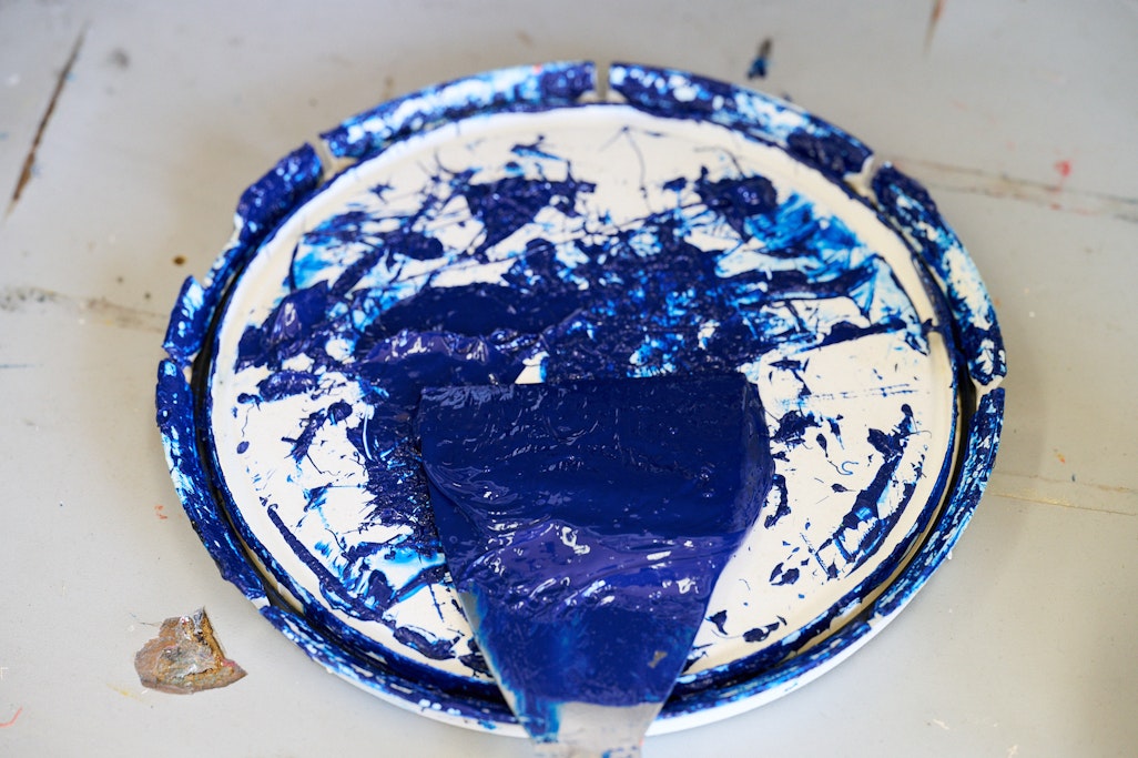 blue paint on a lid of a paint container at Groovy Print Shop
